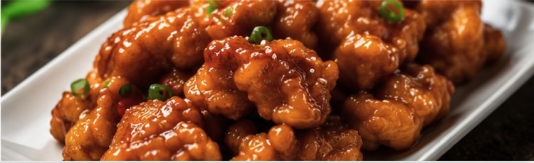 Crispy orange chicken in signature orange sauce